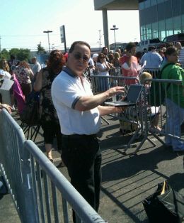 Tim O'Brien checks his email while waiting on line at the casting call.